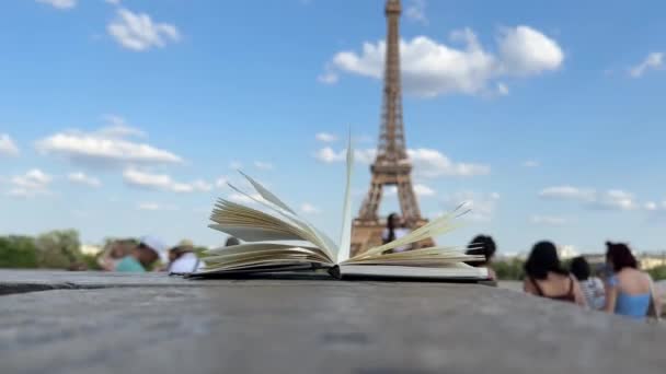 Wind Flipping Notebook Pages Eiffel Tower Background Paris France Concept — Stock Video