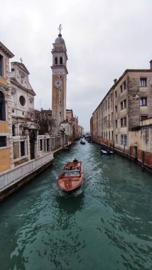 The boat floats on the canal
