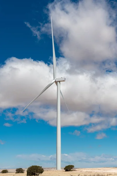 Vertical view of a wind turbine generating electrical power in a wind farm in New Mexico