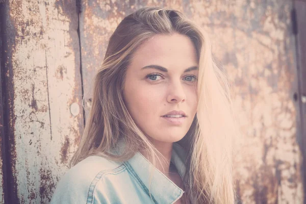 stock image beautiful close up of an attractive blonde woman with blue eyes looking at the camera - natural beauty and no makeup 