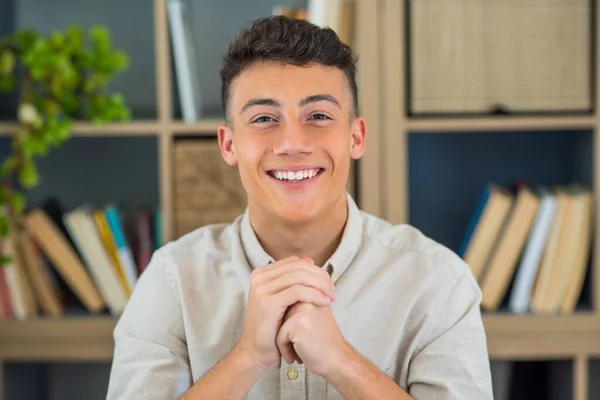 stock image Portrait of one young and happy cheerful man smiling looking at the camera having fun. Headshot of male person working at home in the office. 