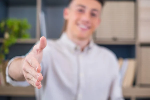 stock image Head shot portrait smiling businessman wearing glasses extending hand for handshake at camera, friendly hr manager greeting candidate on interview, offering deal, welcoming client at meeting 