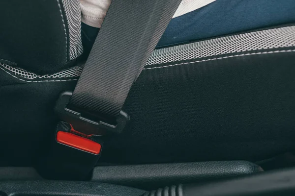 stock image Close up of seat belt, with driver driving in security being safe and having care.