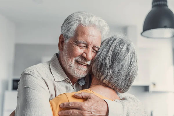 stock image Happy mature couple in love embracing, laughing grey haired husband and wife with closed eyes, horizontal banner, middle aged smiling family enjoying tender moment, happy marriage, sincere feelings