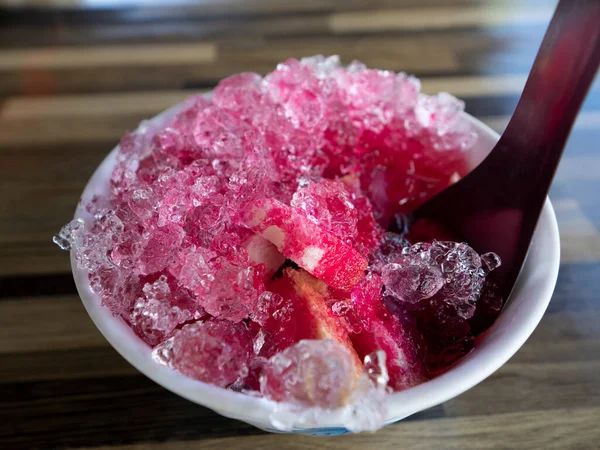 shaved ice on bread include grenadine in cup
