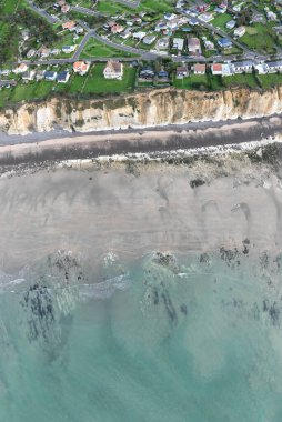 Aerial view taken with a drone showing the town of Quiberville in Normandy, the beach, the cliffs and the sea in good weather