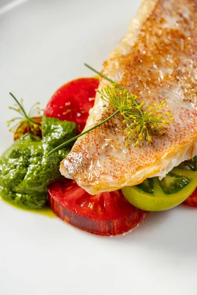 Grilled Sea Bass Fillet Green Red Tomatoes Pesto Sauce Food — Stock Photo, Image