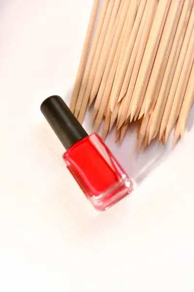 nail polish and wooden sticks for manicure and pedicure