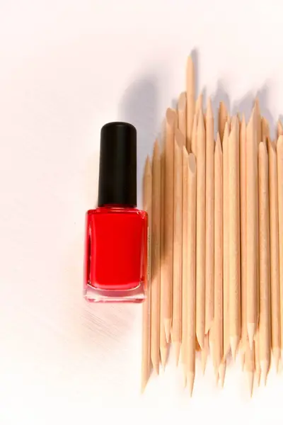nail polish and wooden sticks for manicure and pedicure