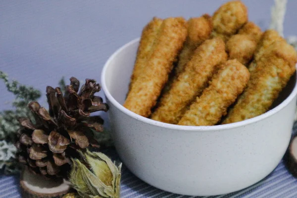 Chicken finger nuggets or chicken nuggets in the form of sticks. Soft chicken meat wrapped in crispy flour.