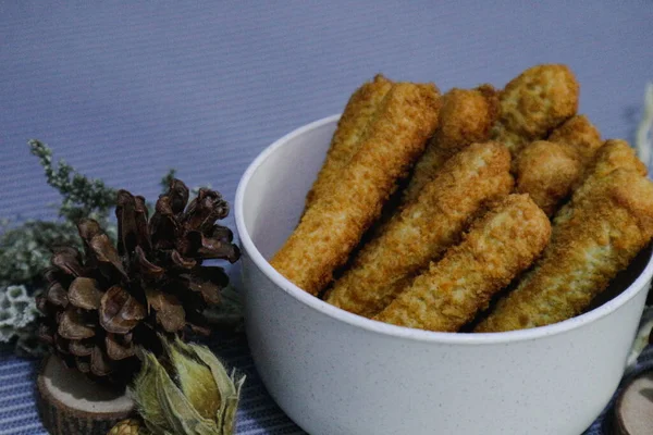 Chicken finger nuggets or chicken nuggets in the form of sticks. Soft chicken meat wrapped in crispy flour.