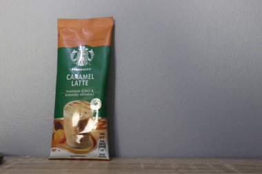 Bekasi, Indonesia on July 2022. Copy space starbucks caramel latte sachet, Starbucks premium instant coffee sachet original from Turkey. We can enjoy Starbucks coffee easily from home.