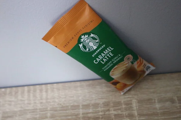 Bekasi, Indonesia on July 2022. Copy space starbucks caramel latte sachet, Starbucks premium instant coffee sachet original from Turkey. We can enjoy Starbucks coffee easily from home.