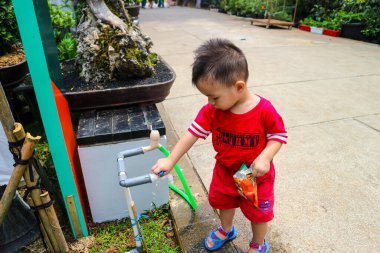 Jakarta, Indonesia in August 2022. Visitors who are lovers of flora and fauna visiting the Flona 2022 exhibition at the Banteng Field . Many families, lots of plant and food traders as well
