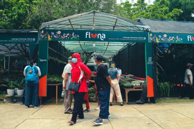 Jakarta, Indonesia in August 2022. Visitors who are lovers of flora and fauna visiting the Flona 2022 exhibition at the Banteng Field . Many families, lots of plant and food traders as well
