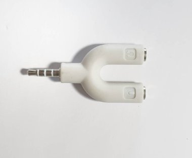 Isolated white photo of U Shape Splitter Jack 3.5 mm Male to Dual Female Headphone and Microphone.