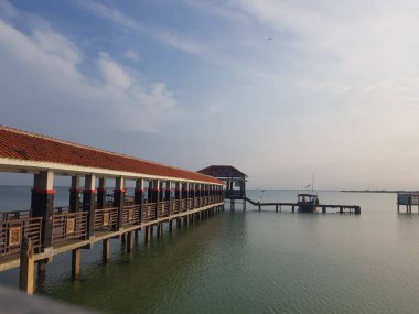 A pier for anchor ships and small boats on a beach called Tirta Samudera Beach or Bandengan Beach in Jepara City.