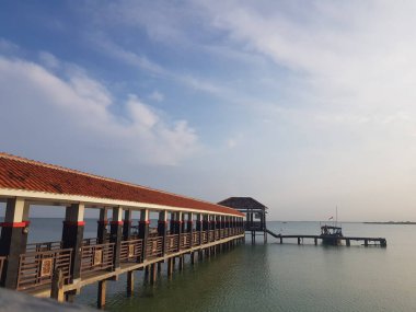 A pier for anchor ships and small boats on a beach called Tirta Samudera Beach or Bandengan Beach in Jepara City.
