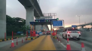 Cikampek, Indonesia in November 2022. The queue of cars that will enter the Cikampek Utama toll gate. The queue will be quite long in Eid or long holidays.