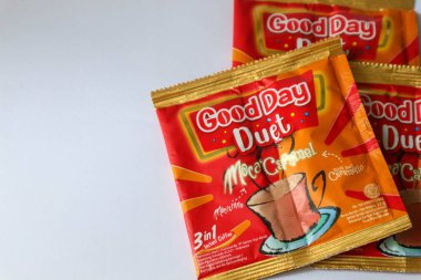 Jakarta, Indonesia in December 2022. Isolated oto from coffee sachets, a new variant of Good Day, Good Day Duet Moca Caramel. Mix Good Day coffee Moccacinno flavor with Rocksalt Caramello in 1 sachet. The taste is unique and delicious.