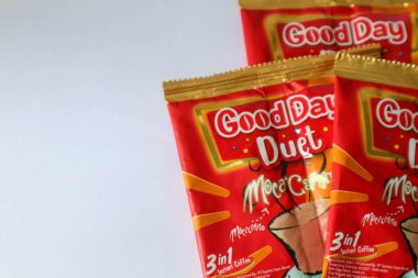Jakarta, Indonesia in December 2022. Isolated oto from coffee sachets, a new variant of Good Day, Good Day Duet Moca Caramel. Mix Good Day coffee Moccacinno flavor with Rocksalt Caramello in 1 sachet. The taste is unique and delicious.