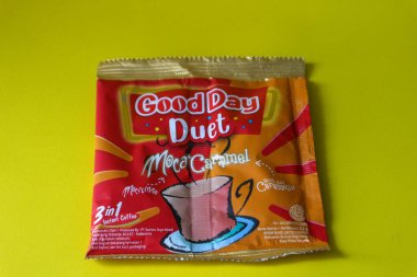 Jakarta, Indonesia in December 2022. Isolated oto from coffee sachets, a new variant of Good Day, Good Day Duet Moca Caramel. Mix Good Day coffee Moccacinno flavor with Rocksalt Caramello in 1 sachet. The taste is unique and delicious.