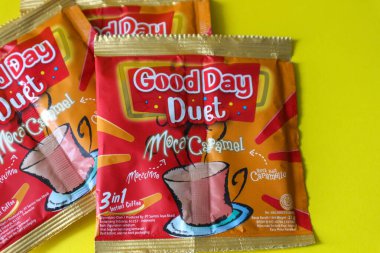 Jakarta, Indonesia in December 2022. Isolated oto from coffee sachets, a new variant of Good Day, Good Day Duet Moca Caramel. Mix Good Day coffee Moccacinno flavor with Rocksalt Caramello in 1 sachet. The taste is unique and delicious.