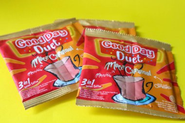 Jakarta, Indonesia in December 2022. Isolated oto from coffee sachets, a new variant of Good Day, Good Day Duet Moca Caramel. Mix Good Day coffee Moccacinno flavor with Rocksalt Caramello in 1 sachet. The taste is unique and delicious.