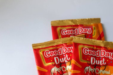 Jakarta, Indonesia in December 2022. Isolated oto from coffee sachets, a new variant of Good Day, Good Day Duet Moca Caramel. Mix Good Day coffee Moccacinno flavor with Rocksalt Caramello in 1 sachet. The taste is unique and delicious.