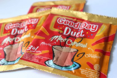 Jakarta, Indonesia in December 2022. Isolated oto from coffee sachets, a new variant of Good Day, Good Day Duet Moca Caramel. Mix Good Day coffee Moccacinno flavor with Rocksalt Caramello in 1 sachet. The taste is unique and delicious.