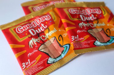 Jakarta, Indonesia in December 2022. Isolated oto from coffee sachets, a new variant of Good Day, Good Day Duet Moca Caramel. Mix Good Day coffee Moccacinno flavor with Rocksalt Caramello in 1 sachet. The taste is unique and delicious.