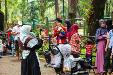 Jakarta, Indonesia in December 2022. The Zoo in Ragunan is one of the favorite places for small and large families which is very crowded during holidays. In this place children can get to know various kinds of animals.