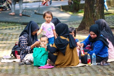 Jakarta, Indonesia in December 2022. The Zoo in Ragunan is one of the favorite places for small and large families which is very crowded during holidays. In this place children can get to know various kinds of animals.