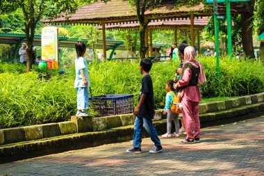 Jakarta, Indonesia in December 2022. The Zoo in Ragunan is one of the favorite places for small and large families which is very crowded during holidays. In this place children can get to know various kinds of animals.