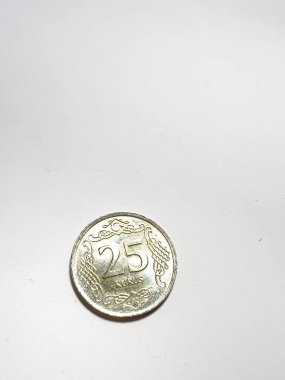 Turkey in June 2022. Isolated white photo of a coin with a denomination of 25 Kurus Turkish lira. Lira is the currency of Turkey. one Turkish lira is equivalent to 100 kurus.