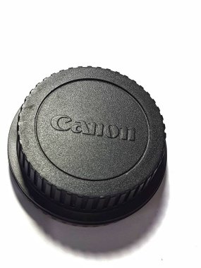 Jakarta. Indonesia on May 2022. Cover the body camera Canon EOS 1100D. The cap is made of plastic, is black in color and has the words CANON embossed on it.