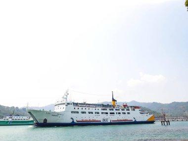 Cilegon, Indonesia in 2018. A passenger ferry with the name Kirana II Ship at Merak Harbor is passing by.