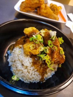 Black Pepper Chicken Mix Rice Bowl from AW Restaurant. Very tasty and filling where in the package contains fried chicken (golden spicy aroma), black pepper chicken rice bowl, chicken soup, drink.