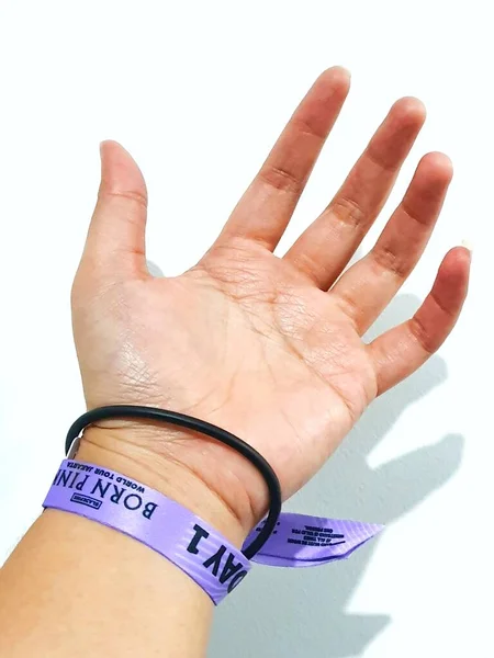 stock image Jakarta, Indonesia on March 2023. Isolated photo of a hand with wristband blackpink concert , Born in Pink Day 1.