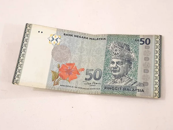 一张林吉特马来西亚人钞票的孤立的白色照片 适用于马来西亚人金融或个人金融的例证 — 图库照片