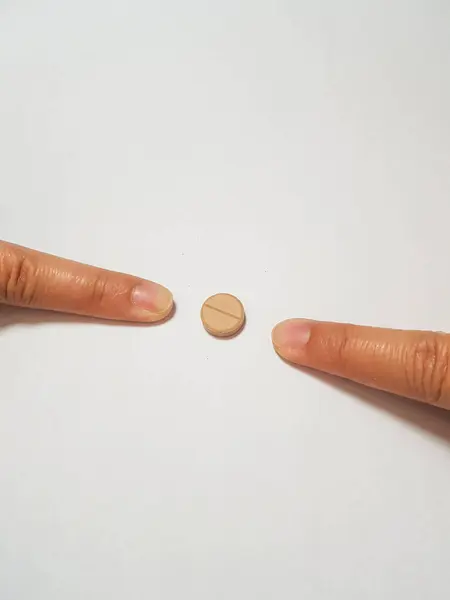 Isolated White Photo Two Forefingers Pointing Brown Medicine Tablet One — Stock Photo, Image