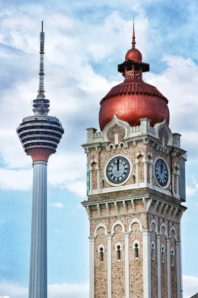 stock image Kuala Lumpur, Malaysia on May 22, 2023. Very beautiful historical architecture of the Sultan Abdul Samad Building. Close up of the clock tower, Big Ben Malaysia. Seen the Kuala Lumpur Tower. .