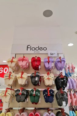 Jakarta, Indonesia on December 21 2023. Fladeo brand sandals on display for sale at a Matahari Department Store. Various types and colors, lots of choices. clipart