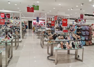 Bekasi, Indonesia on December 20 2023. Various types of shoes and sandals at the Matahari Mall store. Matahari is one of the malls in Indonesia with goods at low prices. clipart