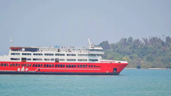 stock image Merak, Indonesia on June 8 2023. A red ferry boat is heading towards the port of Merak. RAP Ferry ship that have jargon 