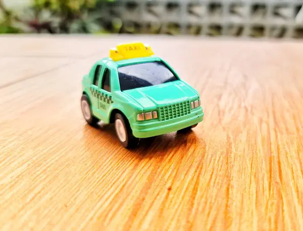 stock image Toy cars in the shape of a green TAXI. Suitable for boys. Die cast car miniature.