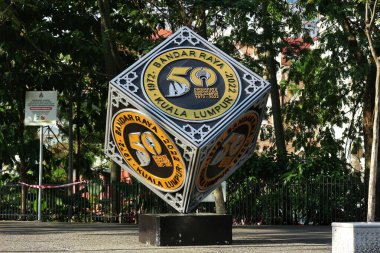 Kuala Lumpur, Malaysia on May 21 2023. A cube-shaped monument to commemorate Dirgahayu Bandar Raya Kuala Lumpur 1972 - 2022. Located in city center Kuala Lumpur clipart