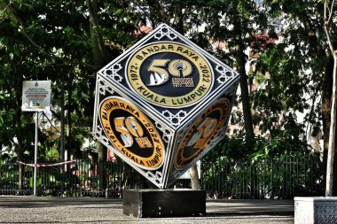 Kuala Lumpur, Malaysia on May 21 2023. A cube-shaped monument to commemorate Dirgahayu Bandar Raya Kuala Lumpur 1972 - 2022. Located in city center Kuala Lumpur clipart