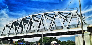 West Bandung, Indonesia on December 12, 2023. The KCIC Padalarang Steel Bridge, West Bandung stretches across the Padaleunyi Toll Road. Steel structures are sturdy and lighter than concrete. Fast. clipart