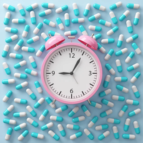 Pink alarm clock on top view with capsule pills spread on the floor. Health care remind you to take your medicine on time, taking sleeping pills, pharmacy, supplements or vitamins. 3D Illustration.